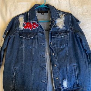 Jean jacket with silver studs and red lettering